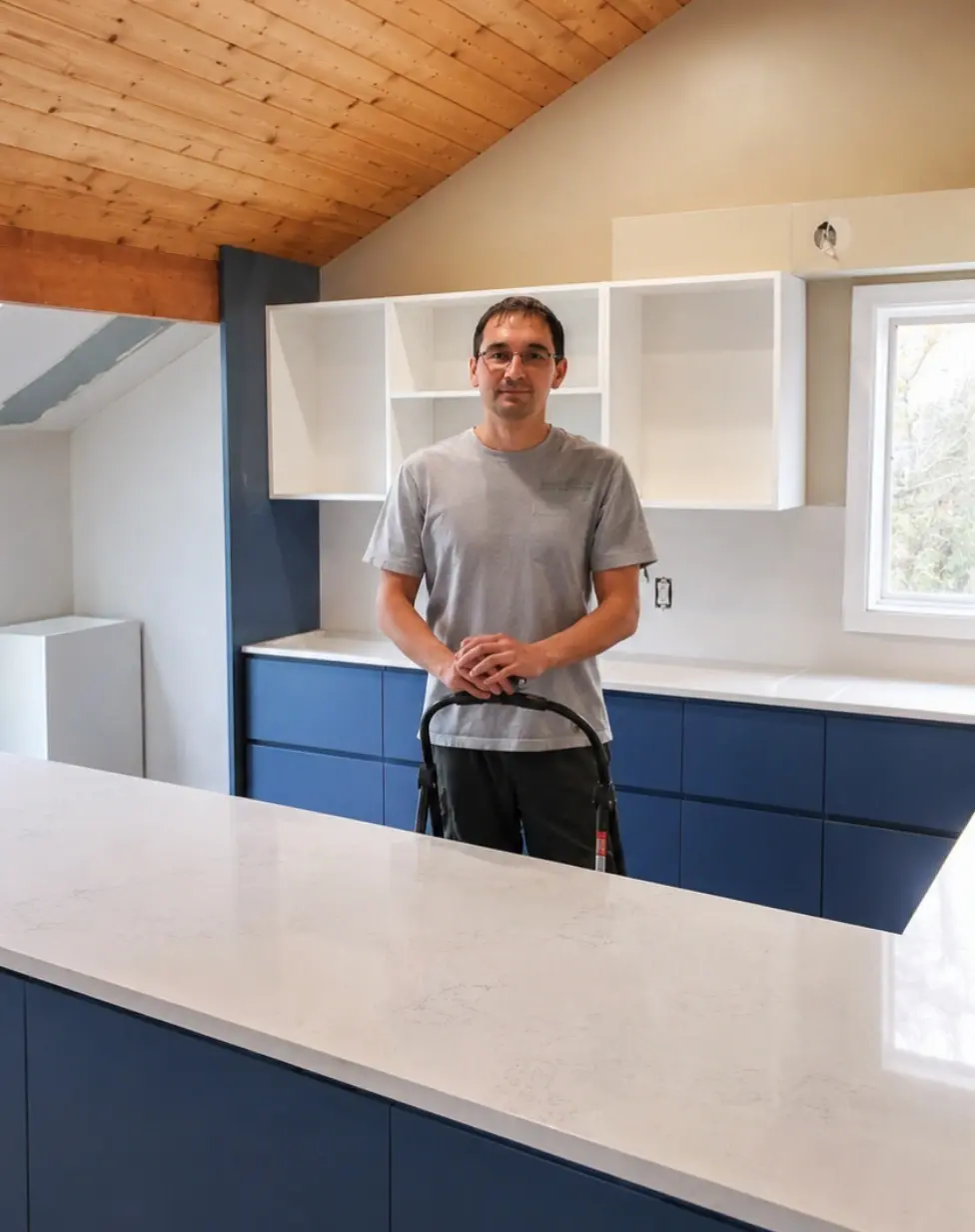 Kamil working on a home cabinet project